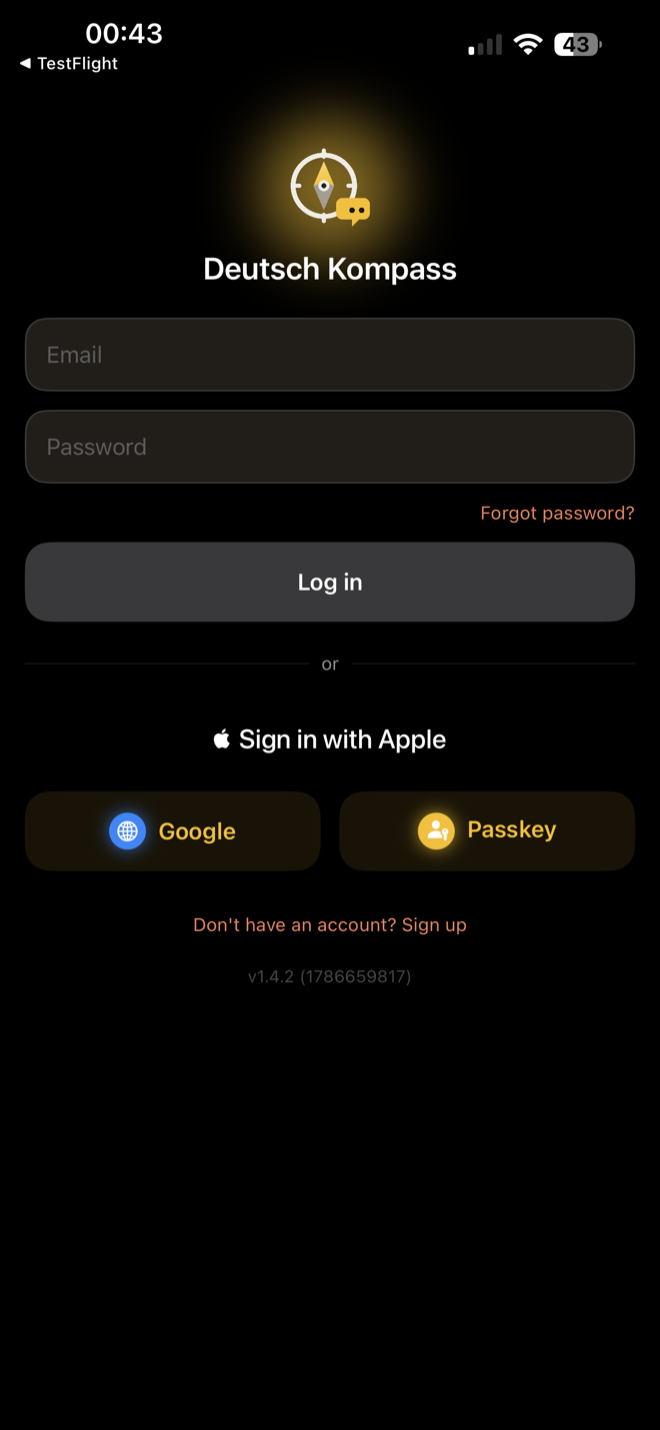Login screen with email and password plus Apple, Google, and passkey sign-in