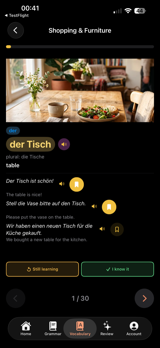 Vocabulary card for "der Tisch" with a photo, example sentences, and audio